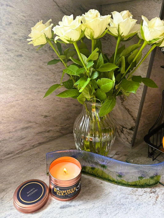 Lit Mairi's Wedding candle with sweet floral romantic scent